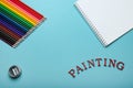 Colored pencils, sketch pad and text painting Royalty Free Stock Photo