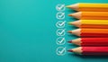 Colored pencils on teal background with checkmarks. Illustration shows creative process organization productivity, planning. Royalty Free Stock Photo