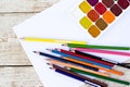 Colored pencils, water colors and paper Royalty Free Stock Photo