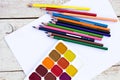 Colored pencils, water colors and paper Royalty Free Stock Photo