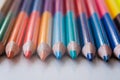colored pencils on a white background, close-up