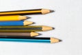 Colored pencils on white background. Lots of different colored pencils. Colored pencil. Pencils sharp. Pencils lie on left. Beauti