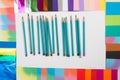 Colored pencils on a white background surrounded by a colored frame Royalty Free Stock Photo