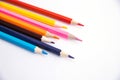 Colored pencils on a white background. Variety of colors. School supplies Royalty Free Stock Photo