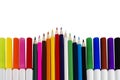 Colored Markers And Pencils Arranged In A Horizontal and Triangular Pattern Royalty Free Stock Photo
