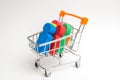 Colored people in a trolley for a supermarket. Concept of human trafficking, modern slavery. Buying people is a violation of inter Royalty Free Stock Photo