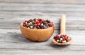 Colored Pepper in the wooden bowl