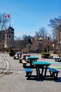 Colored Picnic Benches Lead To Old Clock Tower In Victoria Park