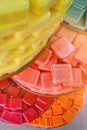 Colored pieces of soap stacked large stack. French translation of Savon - soap