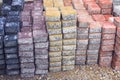 Colored piles of concrete paving slab outdoors.