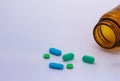 Colored pills. Legal drugs. Medications for humans. Brown glass container