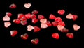 Colored (pink, red and orange), transparent heart shape jellies, black background Royalty Free Stock Photo