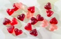 Colored (pink, red and orange), transparent heart shape jellies, colored degradee background Royalty Free Stock Photo