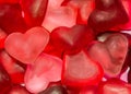 Colored (pink, red and orange), transparent heart shape jellies, colored degradee background Royalty Free Stock Photo