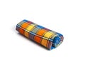 Colored plaid folded fabric isolated, plaid kitchen towel, picnic decoration element Royalty Free Stock Photo
