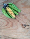 Colored plantain on a wooden background. PlÃÂ¡tanos de colores en un fondo de madera