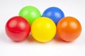 Colored plastic balls on white background. leisure and game items. round objects Royalty Free Stock Photo