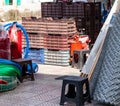 Colored plastic boxes for fruit stacked in piles for sale