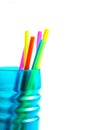 Colored plastic drinking straws in the blue cup. Royalty Free Stock Photo