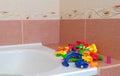 Colored plastic piece designer slide for balls in the bathroom.