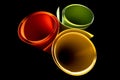Colored plastic sheeting rolls with beautiful shade and shadow on black background