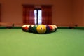 Colored pool balls on a green pool table. Billiard ball with number one Royalty Free Stock Photo