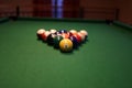 Colored pool balls on a green pool table. Billiard ball with number one Royalty Free Stock Photo