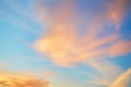 Colored porous clouds at sunset against blue sky. Dramatic sky.