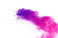 Colored powder explosion. Colored dust splatted. Royalty Free Stock Photo