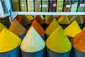 Colored pyramids of cooking spices, natural condiments Royalty Free Stock Photo
