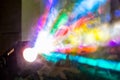 The colored rays of light from the searchlight through smoke. A theatrical performance, concert or disco. Lighting equipment Royalty Free Stock Photo