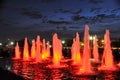 Colored Red Light Fountains in Victory Park Against Dusk Sky - V