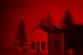 Colored with red light Handmade small house with 3 pine trees. Royalty Free Stock Photo