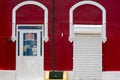 Colored red wall and white doors, colonial architecture in Venezuela