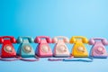 Colored retro telephones on blue background.