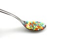 Colored rice on spoon