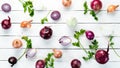 Colored ripe onions on wooden board on white wooden background. Top view