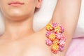 Colored round candy on female armpit Royalty Free Stock Photo