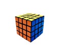 Colored rubik`s cube with faces of yellow, orange, blue colors on a white background