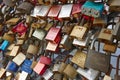 Colored rusted padlocks chained on a bridge handrail. Romantic Royalty Free Stock Photo