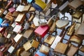 Colored rusted padlocks chained on a bridge handrail. Romantic Royalty Free Stock Photo