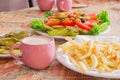 Colored salad and french fries with Pickled Cucumber and cups juice