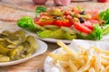 Colored salad and frensh fries with Pickled Cucumber