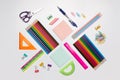 Colored school supplies for learning on a white background. Back to school. Pens, rulers, pencils and paper clips. Flat lay, top Royalty Free Stock Photo