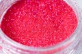 colored sequins in a plastic jar close-up Royalty Free Stock Photo