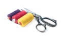 Colored sewing thread coils with old metal scissors on white background Royalty Free Stock Photo