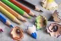 colored sharp pencils and colored pencil shavings. Royalty Free Stock Photo