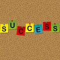 Colored sheets of paper with word Success pinned to a cork message board Royalty Free Stock Photo