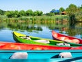 Colored sit on top kayaks or boats for rent on Comana Lake in Comana Natural Park, Romania