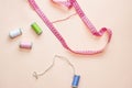 Colored skeins of thread on top of a beige background. Photo in a flat style, the layout of items for sewing.